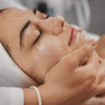 Woman receiving a relaxing facial treatment at a spa