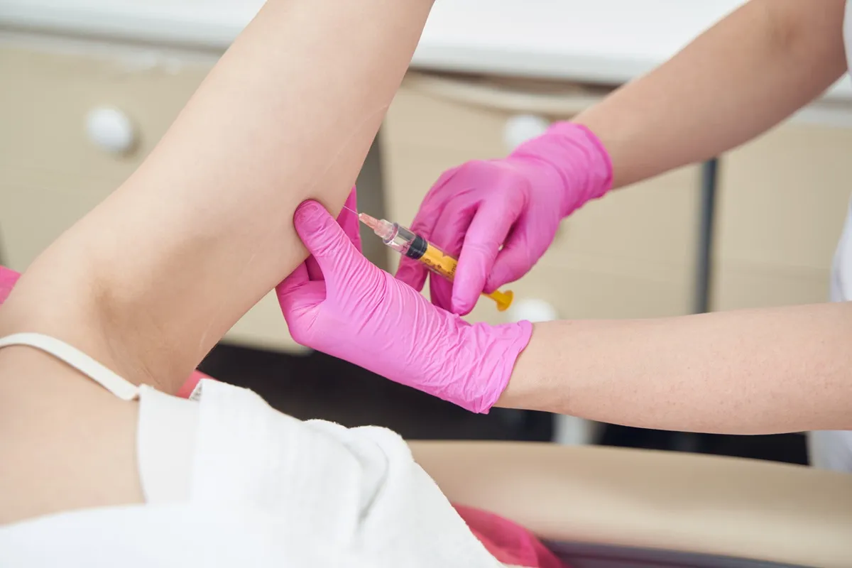 Female getting Lipolysis fat-dissolving injection​ at Lips Boutique® and Beauty Lab in Toronto, ON