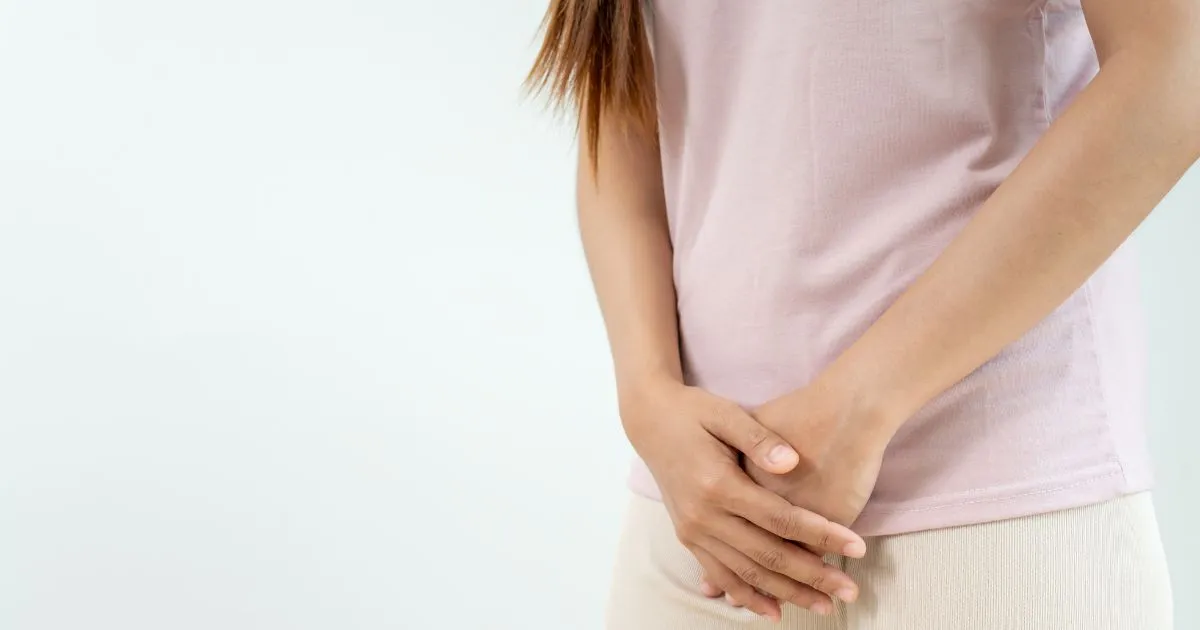 Medical professional applying a laser or radiofrequency device to a patient's leg, representing non-surgical laser technology used for vaginal tightening