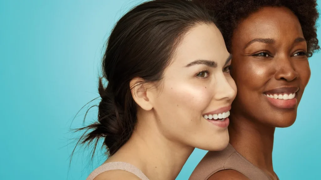 Two women with smooth, hydrated, glowing skin after SKINVIVE by JUVÉDERM treatment